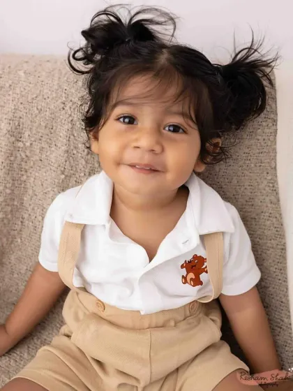 The cutest little pigtails and the sweetest smile! This close-up shot is all about capturing the adorable details of this little munchkin.