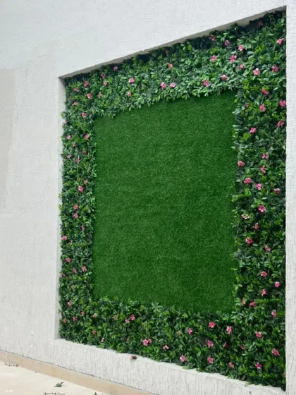 A closer look at the framed green wall in Himachal. The detail in the flowering border adds depth and realism to the installation.