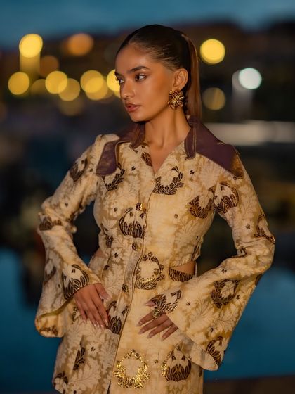 A closer view of the Nespresso event outfit, showing the intricate print and the stylish bell sleeves.