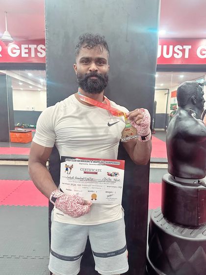 Another one of our champions with his gold medal. His hard work and dedication paid off in the ring.