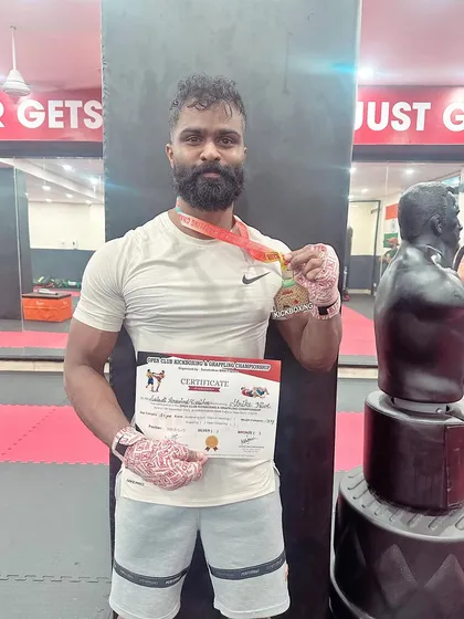 Another one of our champions with his gold medal. His hard work and dedication paid off in the ring.