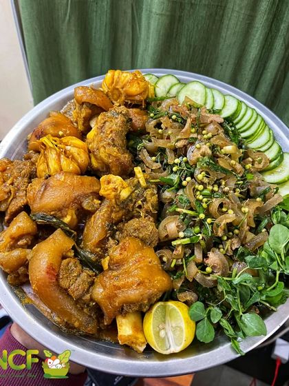 A platter for true pork lovers. This features tender pork trotters alongside a spicy pork skin singju, offering two distinct and delicious preparations.