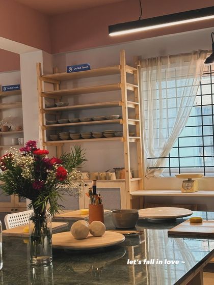 A quiet corner of the studio, ready for the day's work. We keep fresh flowers and make sure the space is clean and organized, so you can walk in and get straight into your creative flow.