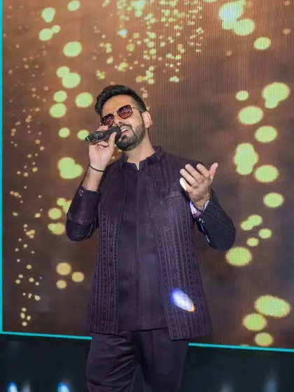 Singing my heart out at a stunning Sangeet Sandhya. Adding a musical touch makes the evening even more memorable.