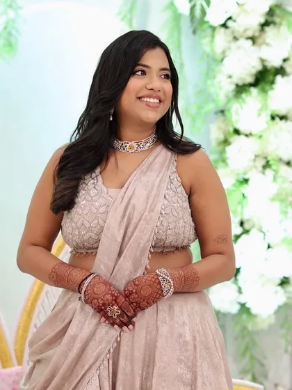 Jeel looking radiant and happy at her engagement ceremony. The makeup is fresh and natural, perfect for the occasion.