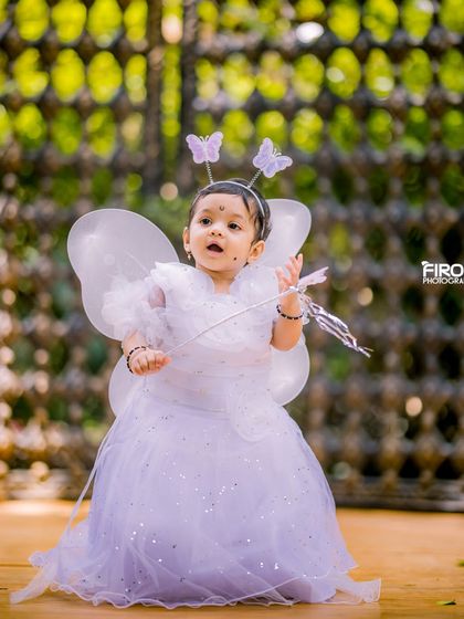 For the little fairy in your life. This photo was taken in our outdoor garden area, which provides a natural, green backdrop that perfectly complements a magical fairy costume.