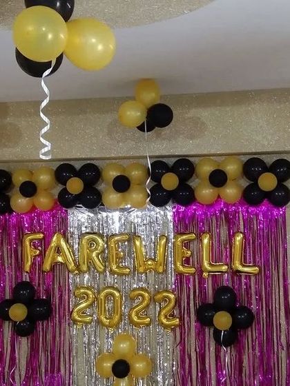 The complete farewell party setup with balloons floating on the ceiling.