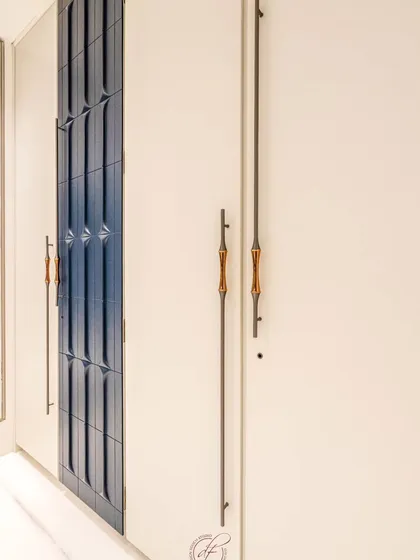 A closer look at the unique custom handles, which combine wood and metal for a sophisticated and tactile feel. This is an example of our commitment to bespoke hardware design.