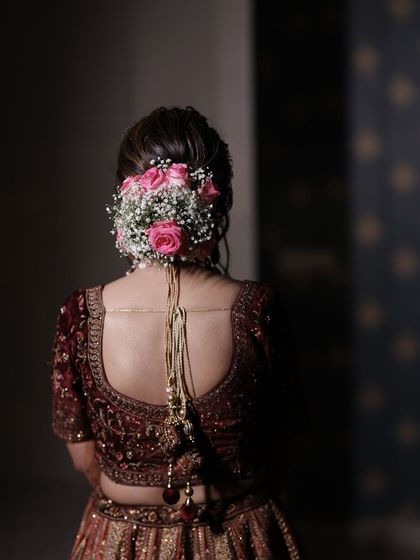 A close-up of the beautiful floral bun, a key element of many traditional Indian bridal hairstyles.