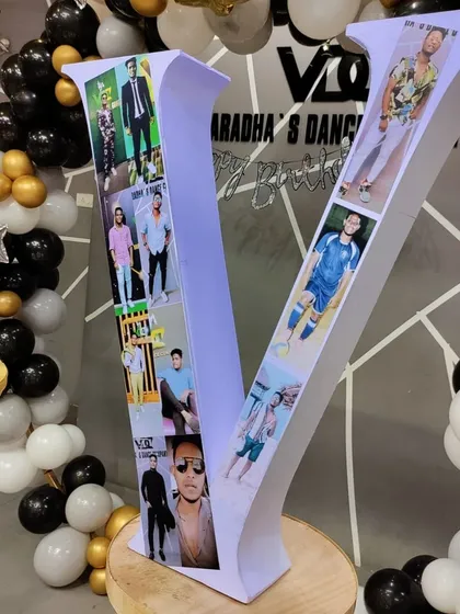 We create custom props like this large letter 'V' decorated with personal photos. It's a fantastic way to personalize a birthday or corporate event and makes for a great conversation piece.