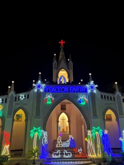 The "Peace on Earth" message illuminated at the entrance of a church. I focus on capturing these details that convey the spirit of the season.