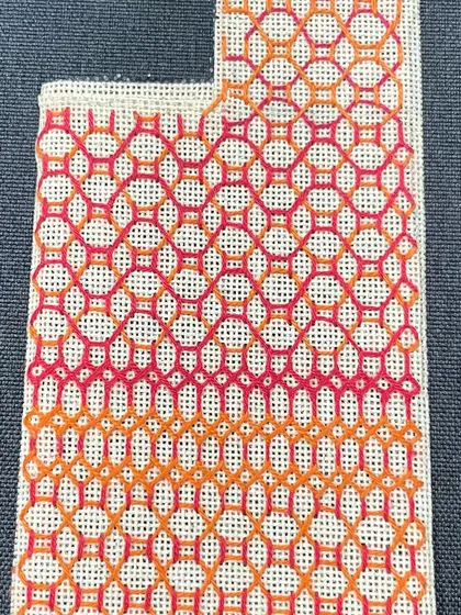 The finished phone insert with a gradient pattern in shades of orange and pink.