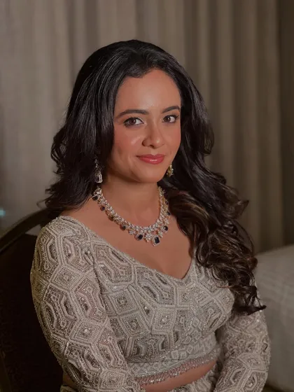 My bride Neha, looking elegant and sophisticated for her reception in a stunning silver-grey lehenga.