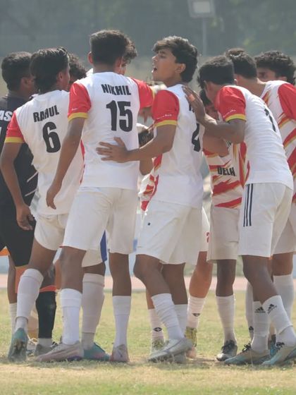 A team huddle before the game. Unity and strategy are key to our success.