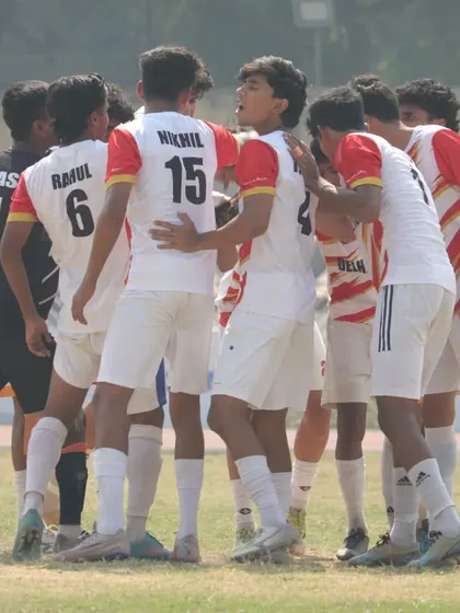 A team huddle before the game. Unity and strategy are key to our success.