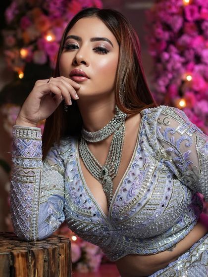 The epitome of beauty. Shimmering eyes and glossy nude lips are the look for the season, and this bride is wearing it perfectly for her reception.