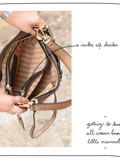 The center zip divider inside the Little Namrata helps to keep the bag's contents neatly organized into three compartments.