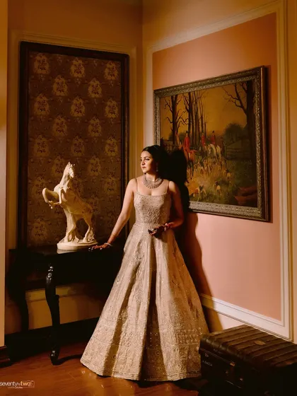 A classic, elegant portrait of the bride in a stunning gown, captured inside the colonial-style interiors of the Mayfair resort, adding a touch of timeless charm.