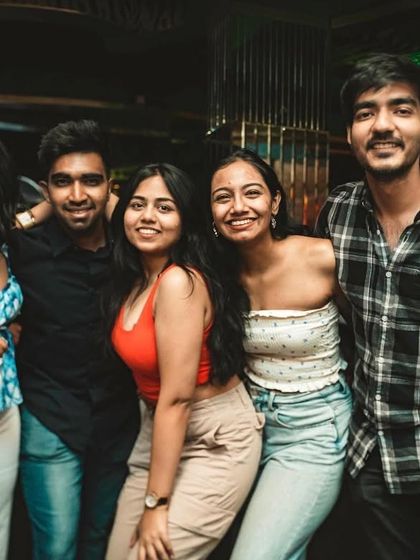 A group of friends enjoying their Sunday night out. This is the kind of vibrant energy you can expect every week.