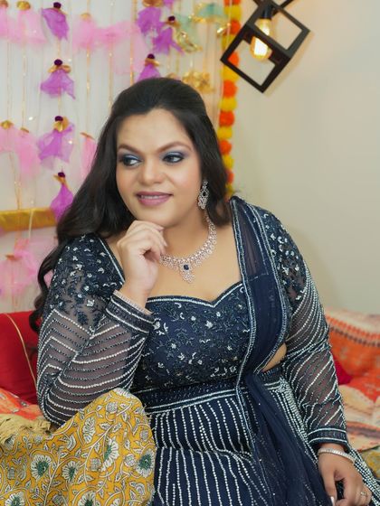 A thoughtful pose that highlights the beautiful blue glitter eyeshadow. This look is perfect for a sangeet or cocktail night.