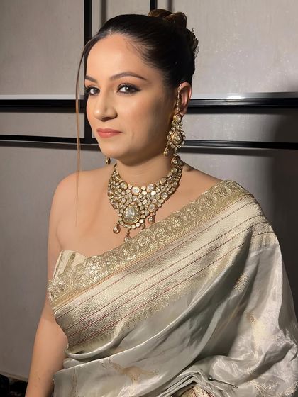 A close-up of the client, her Polki jewelry and soft glam makeup creating a look of pure elegance.