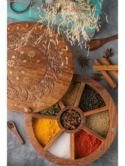 A beautifully crafted wooden spice box, shot for a product brand. The focus here is on the rich colors and textures of the spices, creating an image that speaks to quality and authenticity.