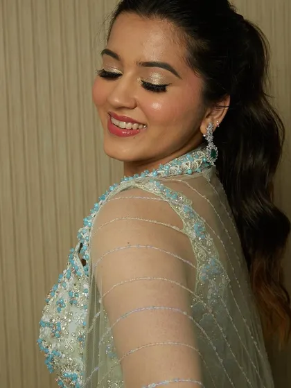 A beautiful cocktail look with shimmery eyes and a glossy lip, created by one of my talented students.