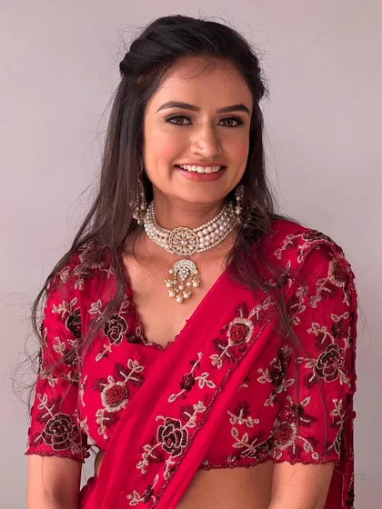 Drenched in red. A classic and bold look in a red saree.