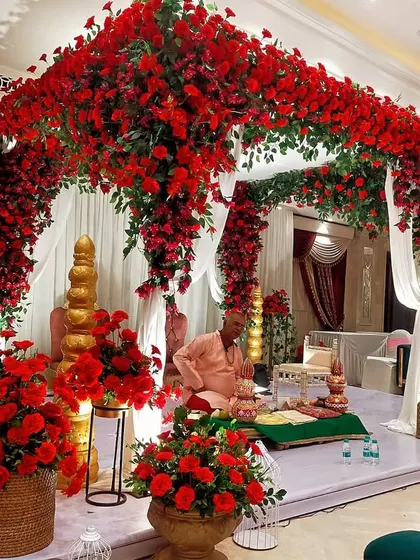 We were honored to create this breathtaking mandap, completely enveloped in a sea of vibrant red roses. This design focuses on creating a luxurious and sacred space for the wedding ceremony, ensuring an unforgettable experience.