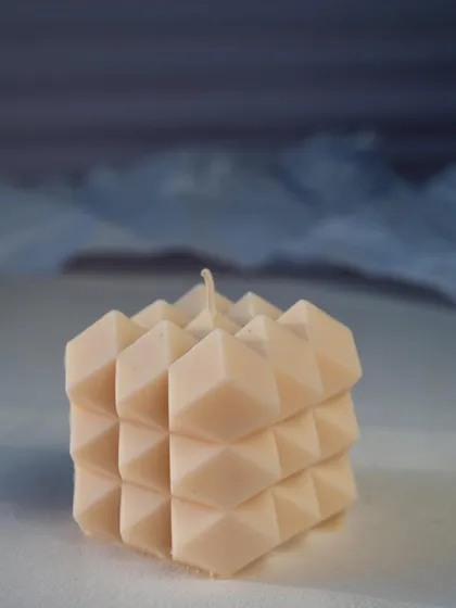 Embrace the beauty of simplicity with our spiky cube candle. Its minimalist design and natural soy wax will enhance your daily life.
