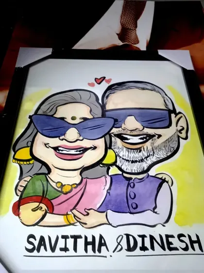 A cool couple's portrait with sunglasses, framed and ready to be gifted. I can add fun props like these to make your caricature even more unique.