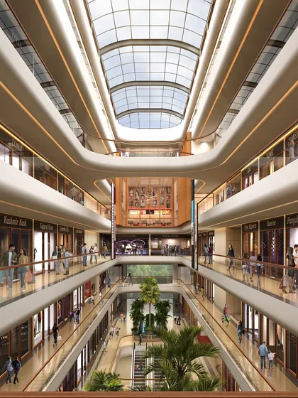 The multi-level atrium of the Town Hall in Siliguri is designed as a vibrant social hub. The grand, curved balconies and expansive glass ceiling create a sense of openness, drawing people into a dynamic retail environment that encourages interaction and community engagement.