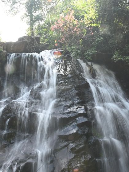 A long exposure shot of the same waterfall, showing the silky smooth water.