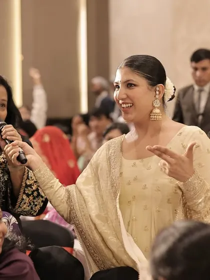My favorite part of hosting is connecting with the guests. Here, I'm sharing a laugh with a family member, making sure everyone feels seen, heard, and included in the fun.