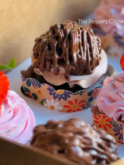 A detailed shot of my Nutella Mousse cupcake. This chocolate cupcake is topped with a rich Nutella mousse and a generous drizzle of more Nutella.