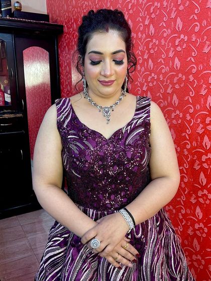 A closer look at the makeup and jewelry paired with my purple gown. I can help you style the entire look from head to toe.