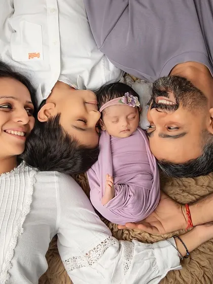 A perfect family moment. We love creating these top-down portraits that show the whole family gazing at their newest member, creating a beautiful memory of love and connection.