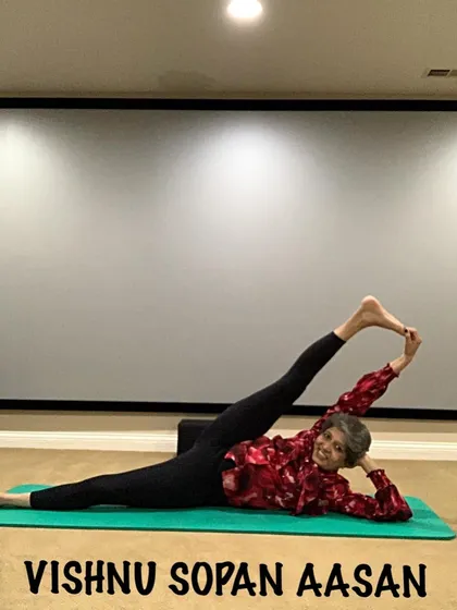Vishnu Sopan Aasan, a reclining leg lift that requires both flexibility and control. It's a wonderful pose for opening the side body and legs.