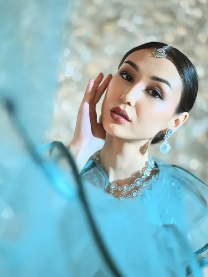An international model looking ethereal in a light blue lehenga and diamond jewellery. My collection is perfect for creating diverse and high-fashion looks.