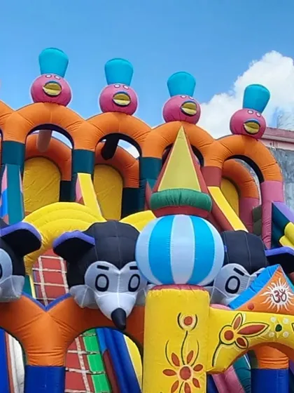 A full view of the top section of my large Mickey Mouse slide. The multiple character heads and bright colors make it look impressive from a distance, attracting kids at any event.