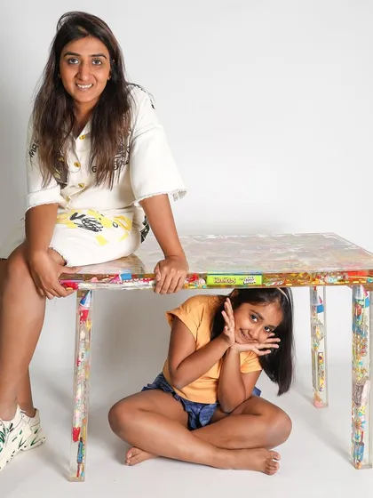My daughter and I with the 'I Spy' table. Her joy and curiosity are the inspiration behind this entire series of preserving memories in resin.
