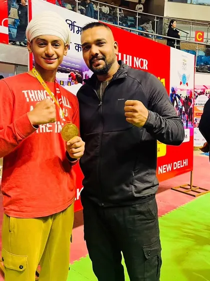 A proud coach moment with one of my students who won gold. His dedication and spirit are an example to all.