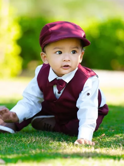 Crawling through the grass on a sunny day. Outdoor sessions are perfect for letting toddlers explore and be active.