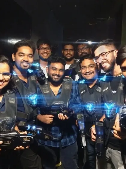 A group of friends smiling and posing after a fun laser tag session.