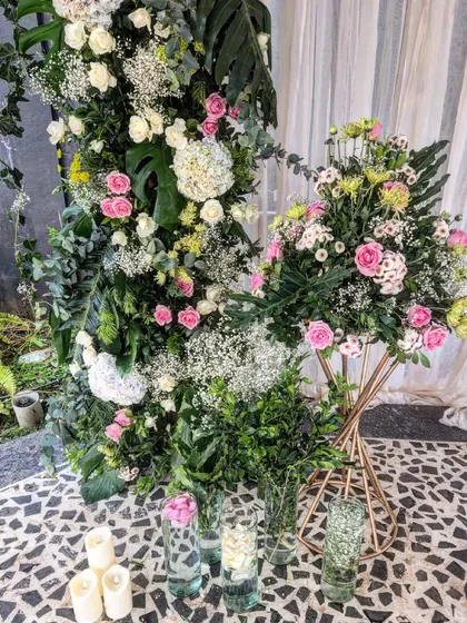 The beauty is in the details. This intricate floral arrangement combines roses, hydrangeas, and baby's breath with lush foliage, showing my commitment to using only premium, real flowers in my designs.