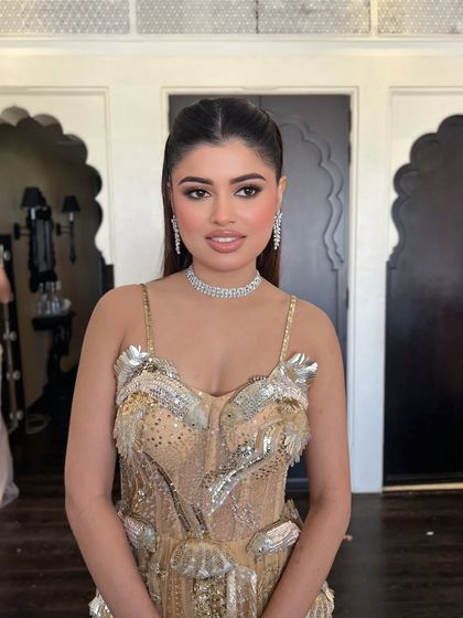 Another portrait of the bride, showcasing her chic and sleek hairstyle.