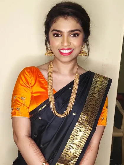 A classic black saree calls for a touch of glam. I gave Deepa a shimmery, smoky eye and a bright smile for her friend's wedding, a perfect look for an evening party.