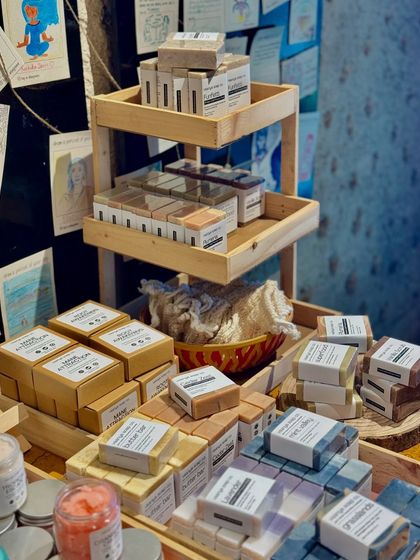 A view of our pop-up display, featuring a multi-tiered stand to showcase our wide range of artisan soaps.