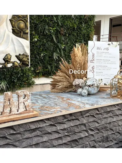 The bar setup for the disco party, featuring a textured bar front and a custom 'BAR' sign.