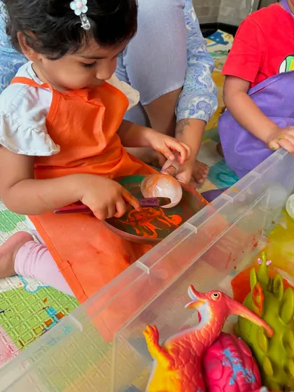 Painting dinosaur eggs was a highlight of our Dino Discovery week. This activity helps develop fine motor skills as children carefully paint their colorful, textured eggs.